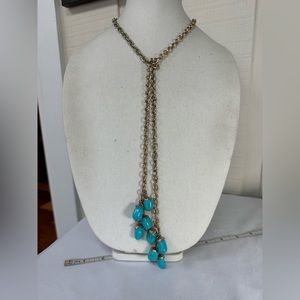 Long lariat style necklace with blue abstract bead dangles